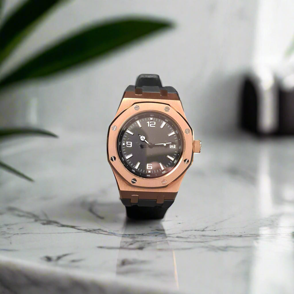 Rose gold watch on a marble benchtop