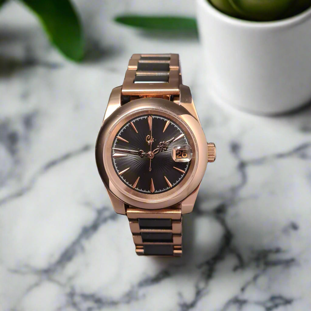 Rose gold watch on a dark background