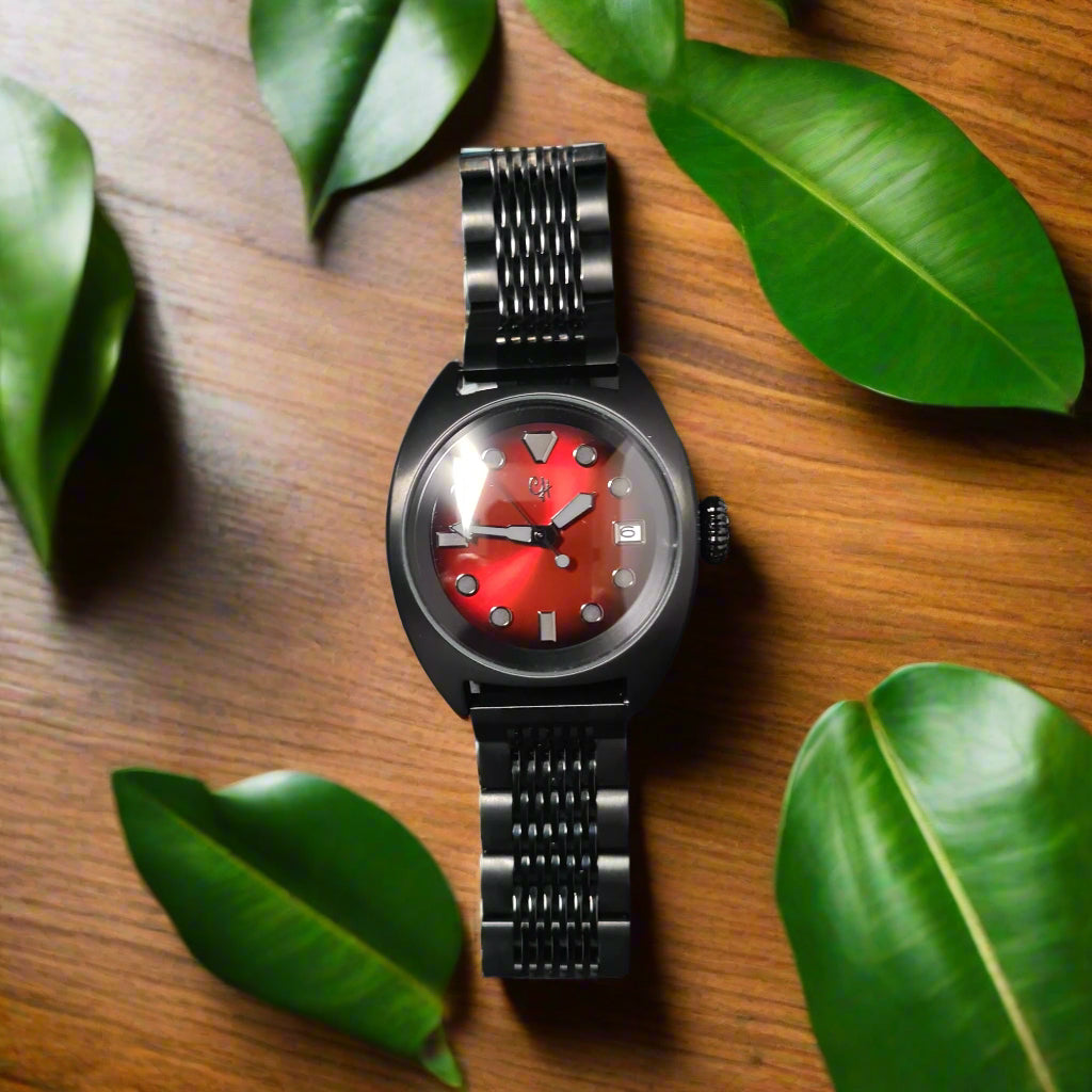 Wristwatch with a red face on a dark gray background