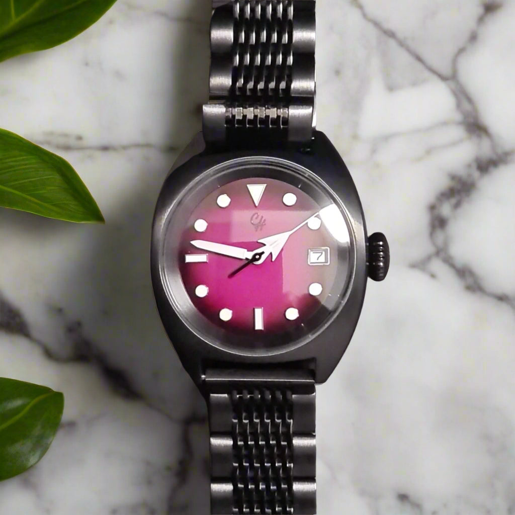 Black wristwatch with a pink face marble