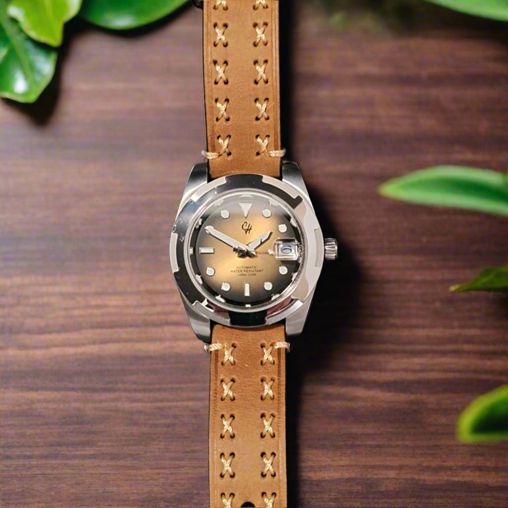 Watch with a brown leather strap oak table