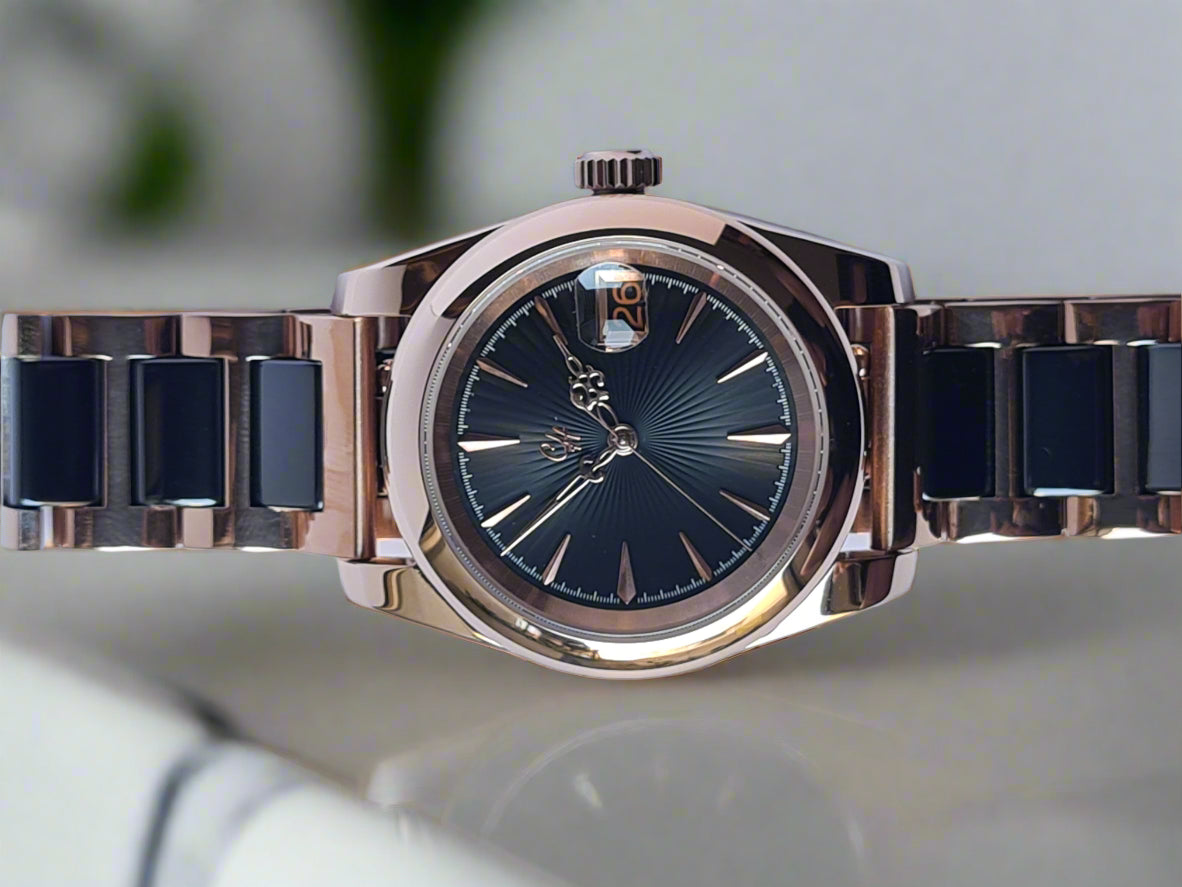 Luxury watch with a rose gold case and black ceramic bracelet on a light blue background
