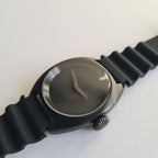 Wristwatch with black strap and silver case on a white background