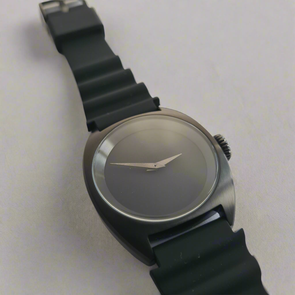 Wristwatch with black strap on a white background