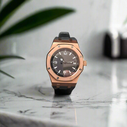 Rose gold watch on a marble benchtop