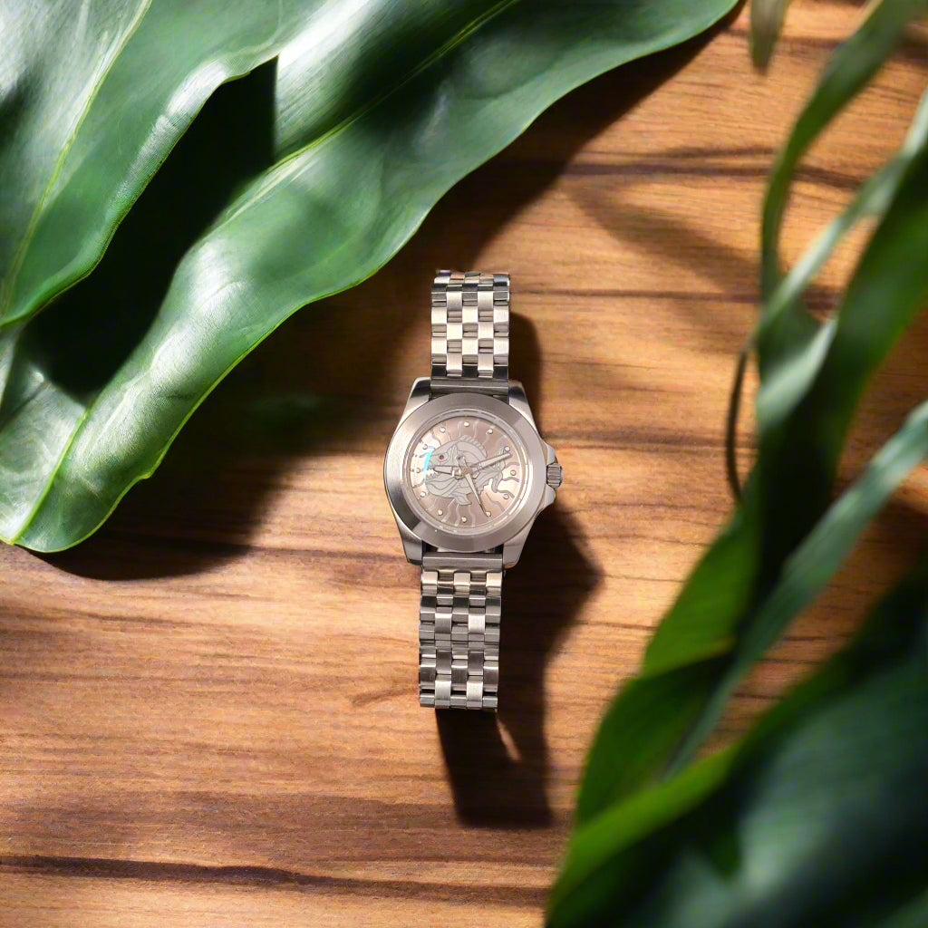 Silver watch on oak table