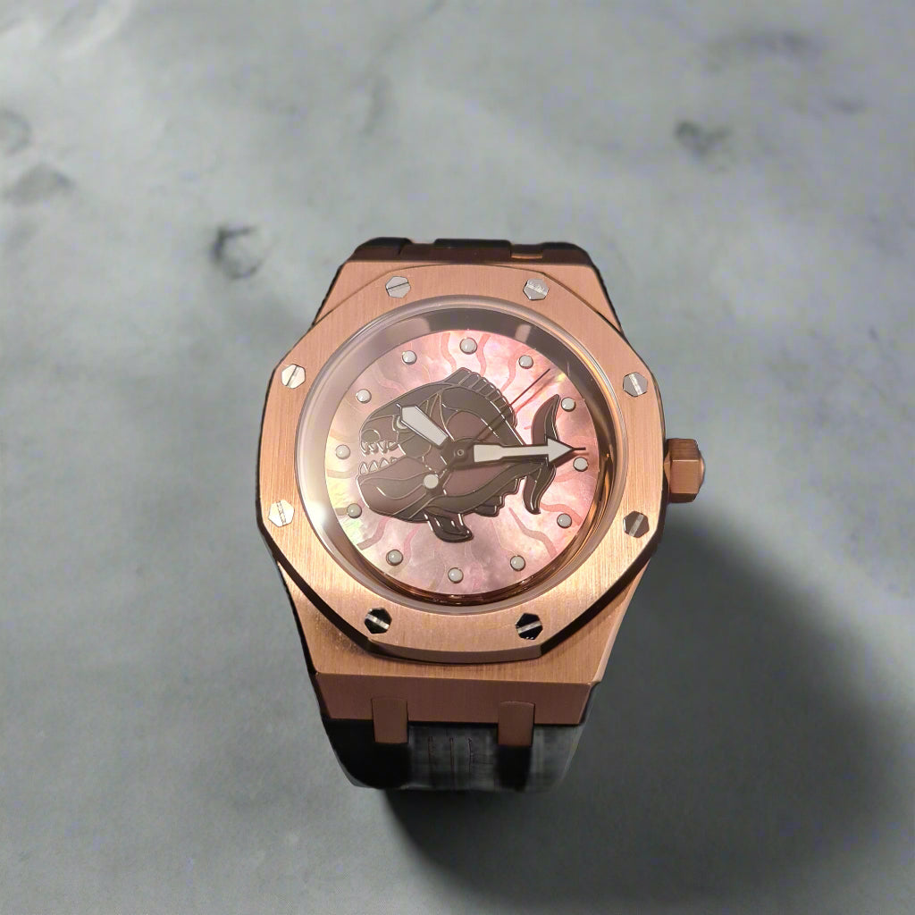 Rose gold watch with a pink face on a grey background