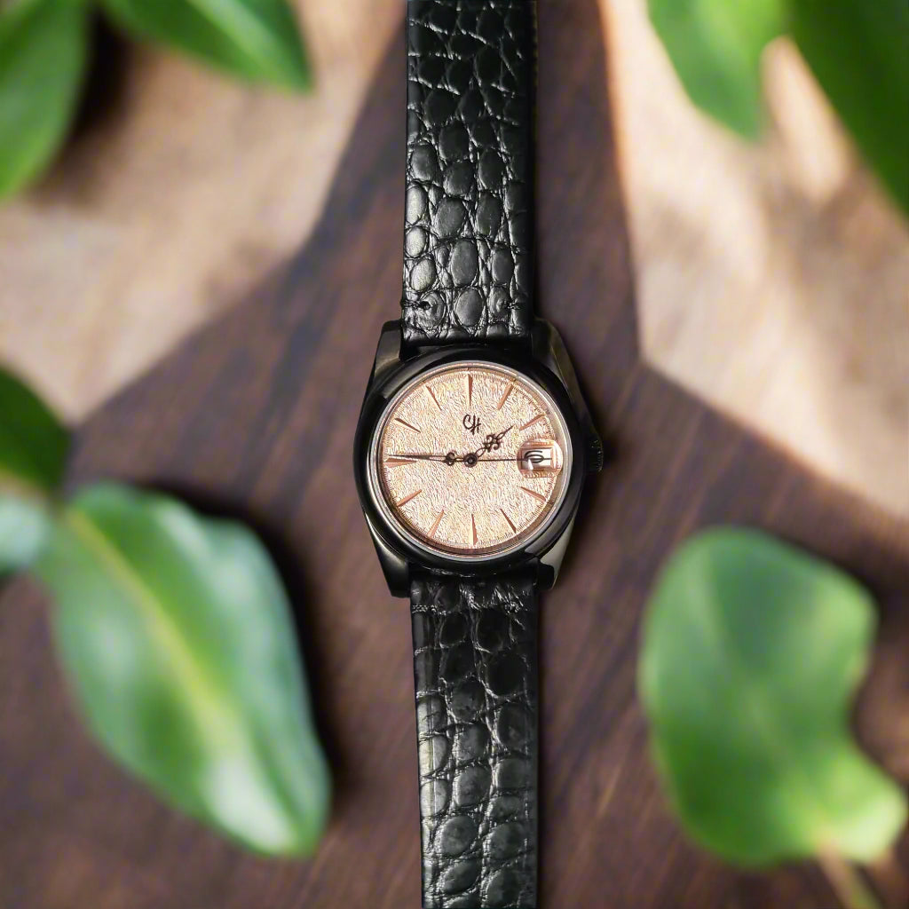 Wristwatch with black leather strap on a dark gray background