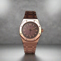 A bold statement piece that fuses modern luxury with everyday power.

With its rich brown dial and striking rose-gold case, The Amber Forge is designed to stand out without compromise. Featuring a distinctive octagonal bezel, matching metal bracelet, and dependable automatic movement, this watch delivers both elegance and resilience.