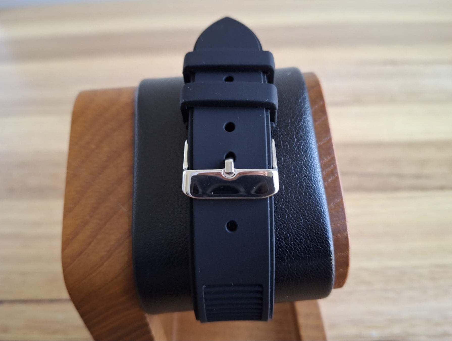 Durable Black Rubber Strap: Flexible, water-resistant rubber strap with a textured finish for all-day comfort and versatility, easily transitioning from boardroom to weekend pursuits, secured by a secure gold-tone buckle.