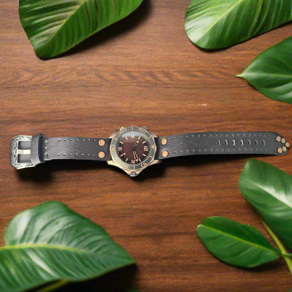 Wristwatch with a dark leather strap on oak table