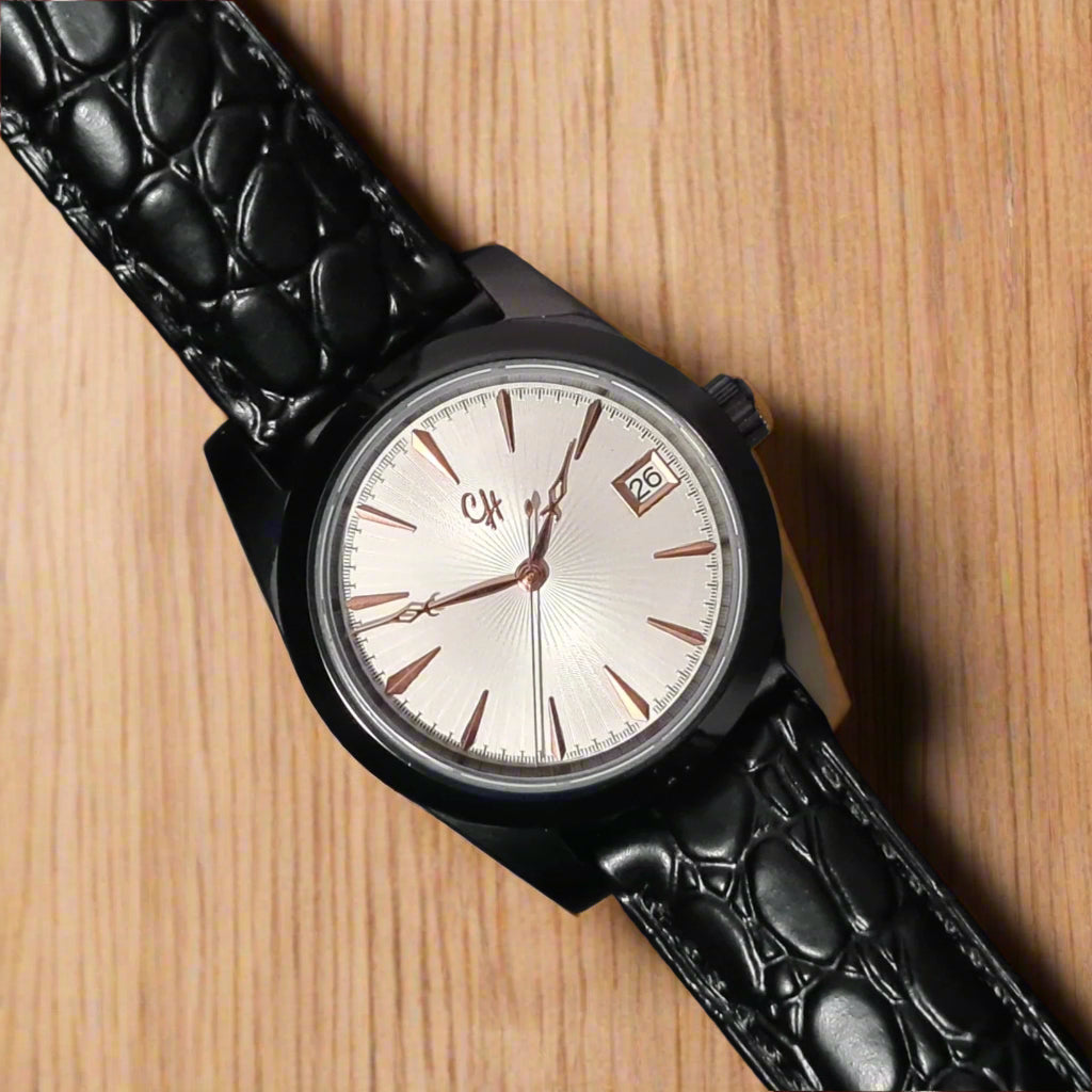 Black wristwatch with a textured strap on a dark background