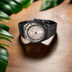 Black wristwatch on a oak table