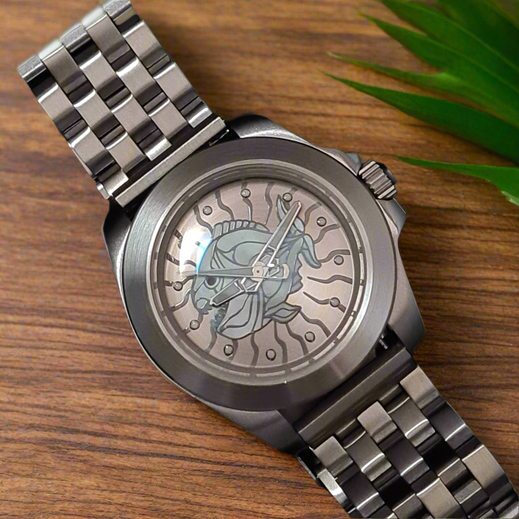 Silver watch with detailed face on a oak table