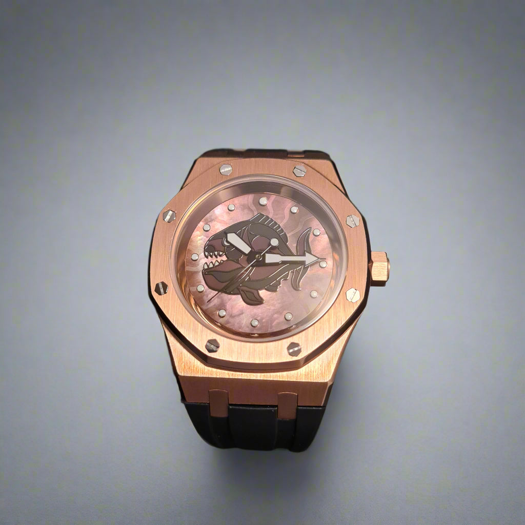 Luxury watch with pink face and rose gold case on a grey background
