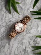 Rose gold watch with a light background