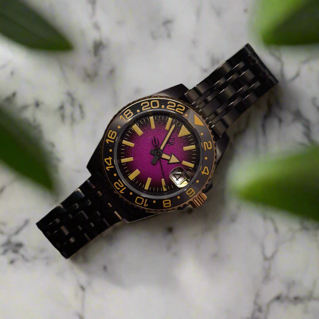 Watch with a purple face and black metal strap on a dark background
