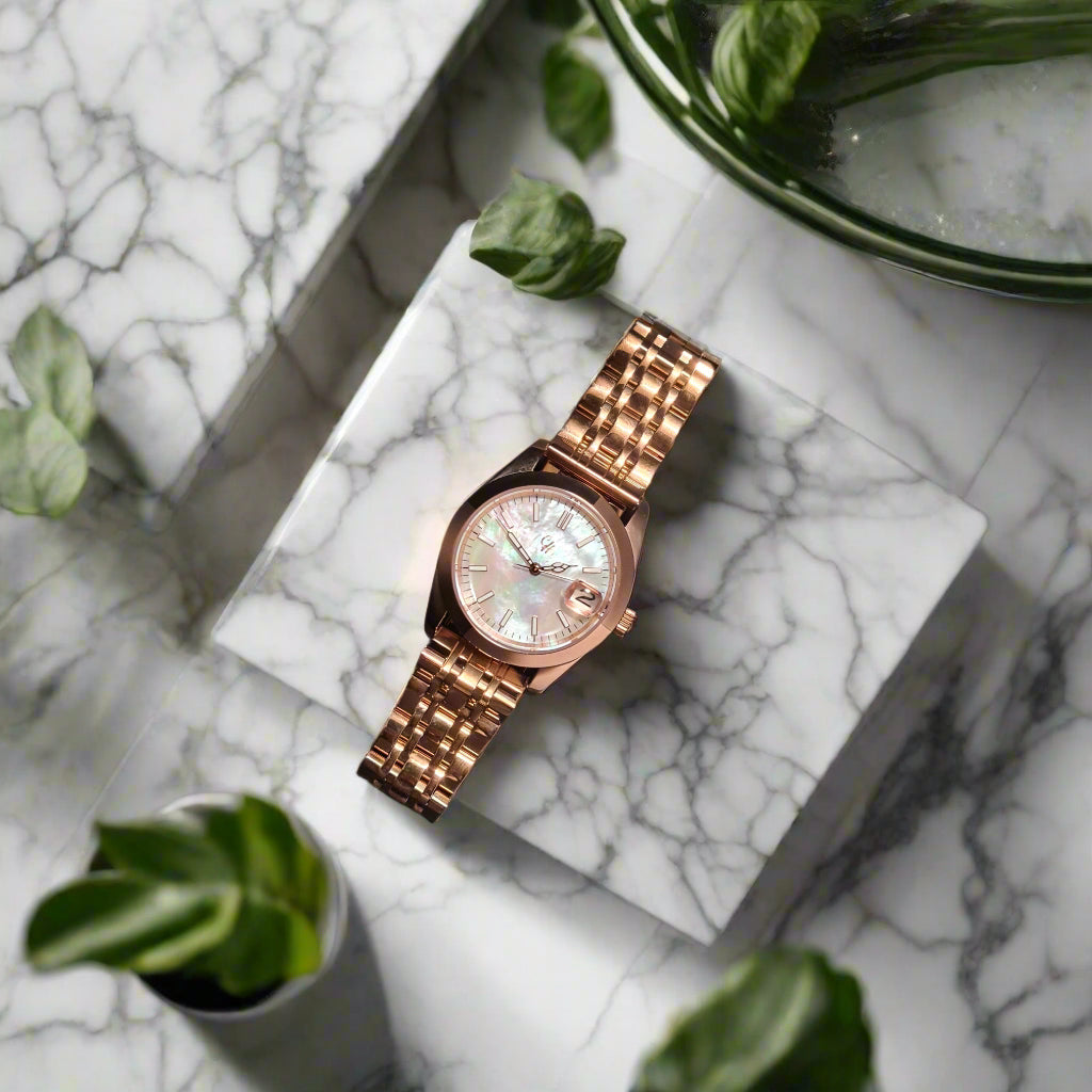 Rose gold watch on a marble background
