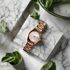 Rose gold watch on a marble background