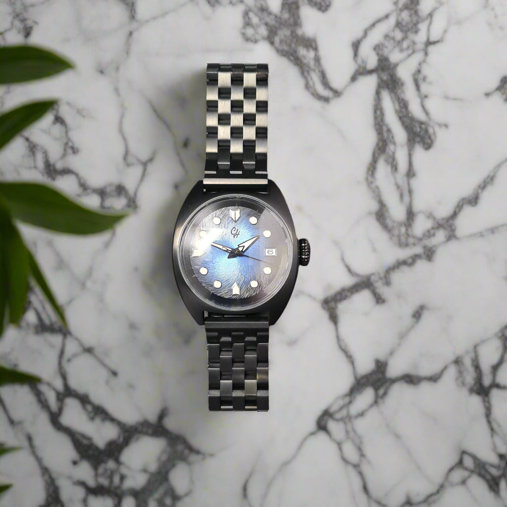 Wristwatch with a checkered band on a dark gray background