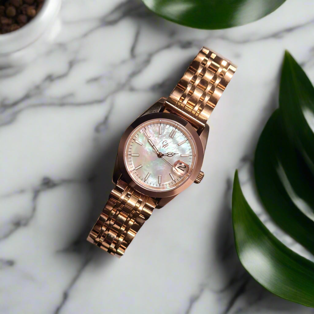 Rose gold watch with a marble background