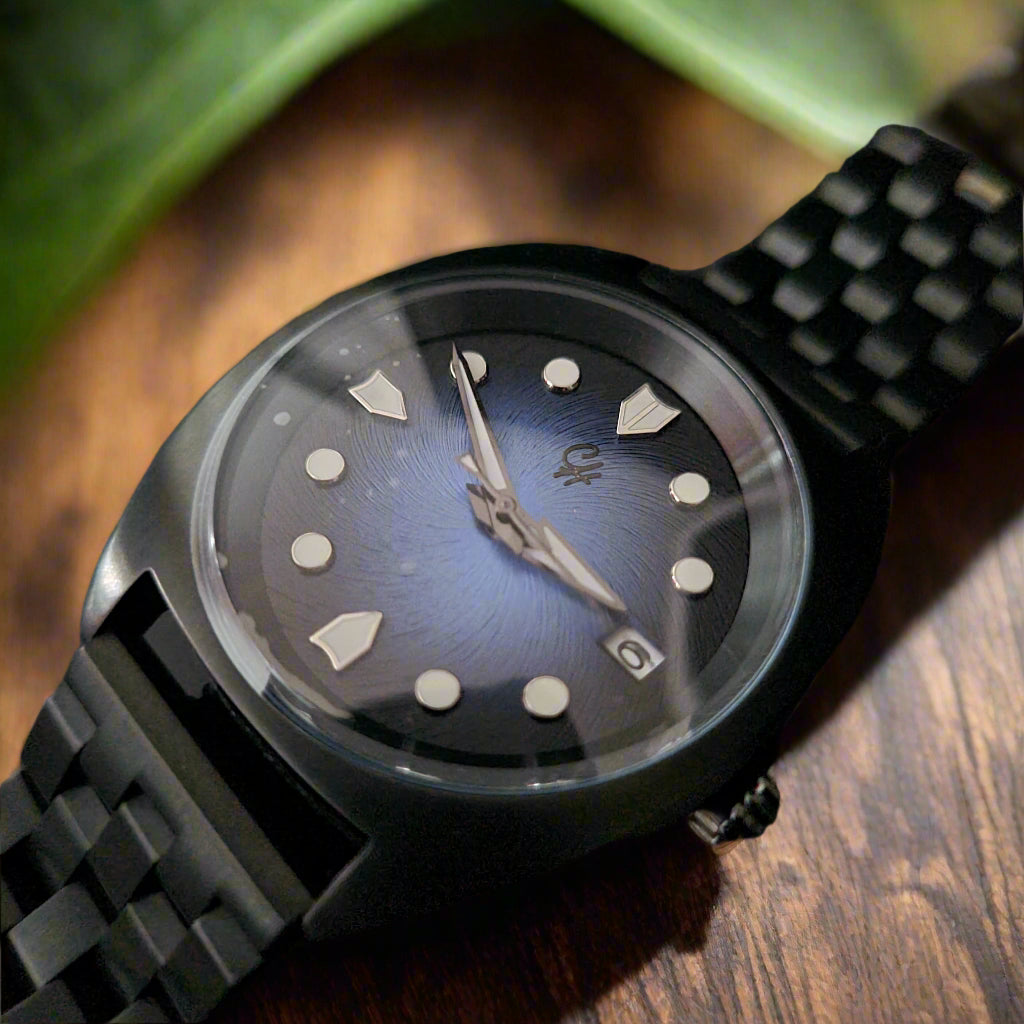 Watch with a black strap and clear face on a dark background