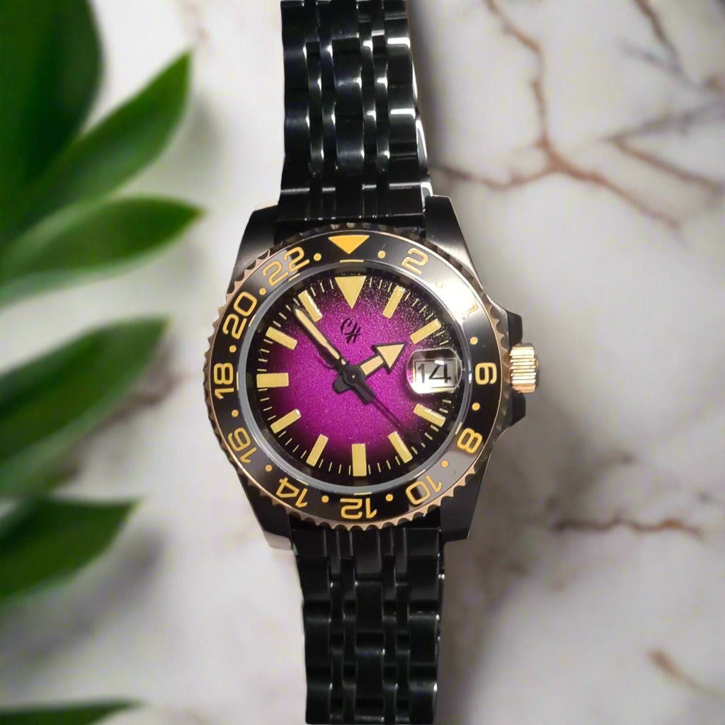 Wristwatch with black metal strap and purple face on a dark background