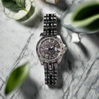 Silver wristwatch on marble table