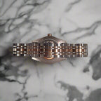 Back of watch on marble bench